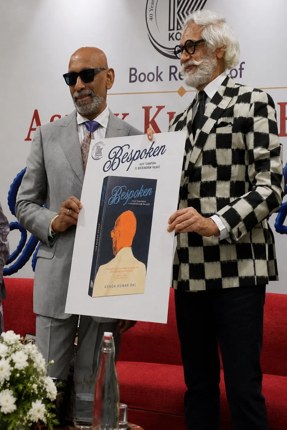 Prof. Andrew M. Ramroop with Sunil Sethi holding the Bespoken jacket at the Delhi launch